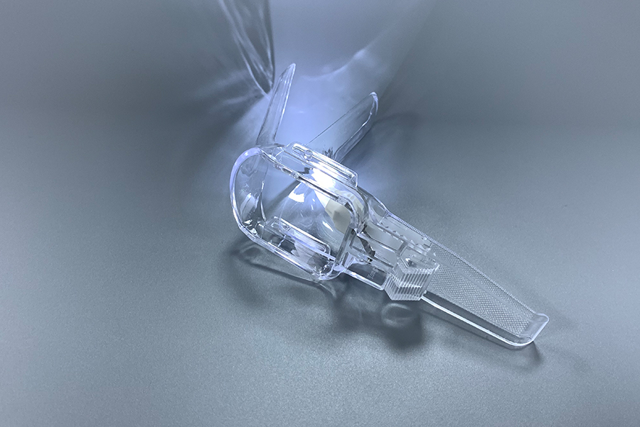 Disposable illuminated vaginal speculum
